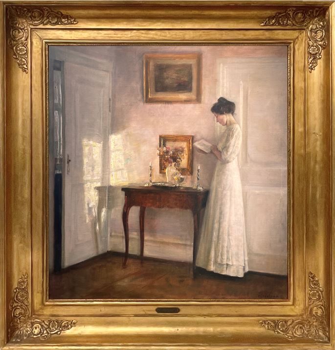 Carl Vilhelm Holsøe - A lady reading in an interior | MasterArt